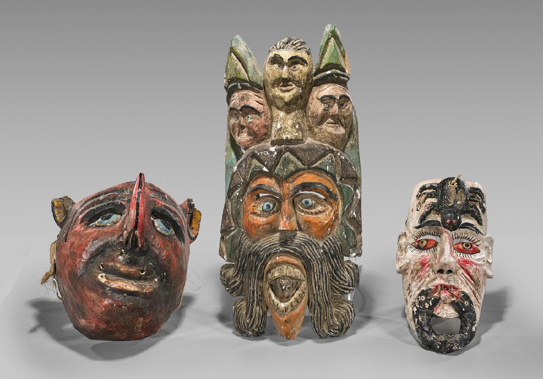 Three Large & Elaborate Mexican Dance Masks: Group of three Mexican carved and polychromed wood dance masks: one depicting a bearded conquistador, with three Catholic figures atop his head and an animal in his mouth; one depicting a red-eyed vis