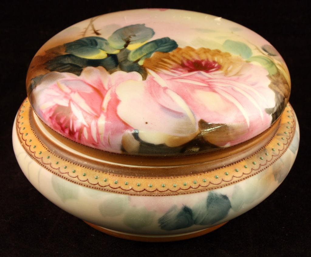 NIPPON Covered Dresser Jar: 5 1/2" inches across. Red/pink roses on top with green beading around rim. Mark #47. Ex. cond. with gold loss to handles.