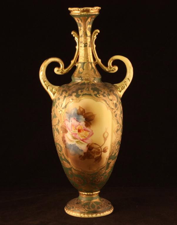 NIPPON Bolted Urn: 14 1/2" bolted with large window on front and back with roses on greenmatted finish. Great gold decoration all over. Excellent condition with gold loss on handles and top rim. Mark 53.