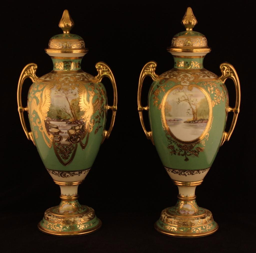 NIPPON Pair Covered two piece Urns: Mint green with front window showing waterfall with gold phonix birds on each side. Window on backshows a lake scene. Lots of gold decoration. Unmarked. Excellent condition.