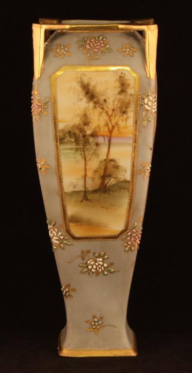NIPPON Four Sided Lake Scene Vase: 12" tall. Land with lake scenes in each of the 4 windows. Two with sailboats. Enameling flowers in pink and white with enameling green leaves throughout. Mark #47. Excellent condition.