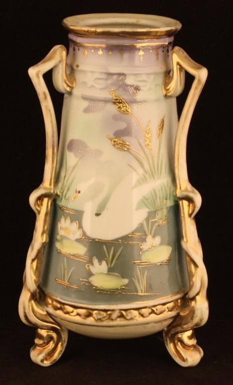 NIPPON Swan on Lake Vase: 9 1/2" tall. Interesting tac handled twisted footed vase. Mark 52. Ex. cond. with major gold loss to rim, handles & feet.