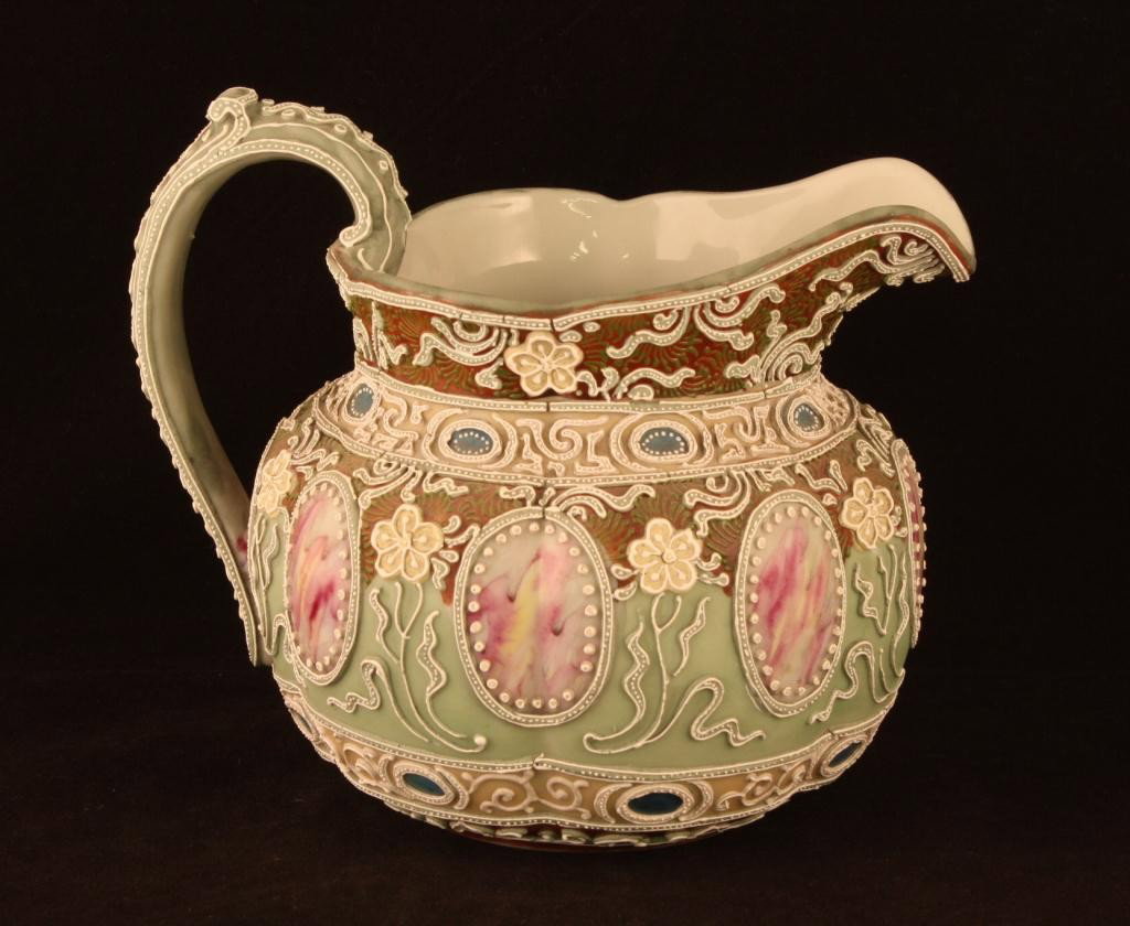 NIPPON Moriage Milk Pitcher: 6.25" tall. Unmarked. 8 windows in red & white. Ex. cond. One bead missing on top of handle.