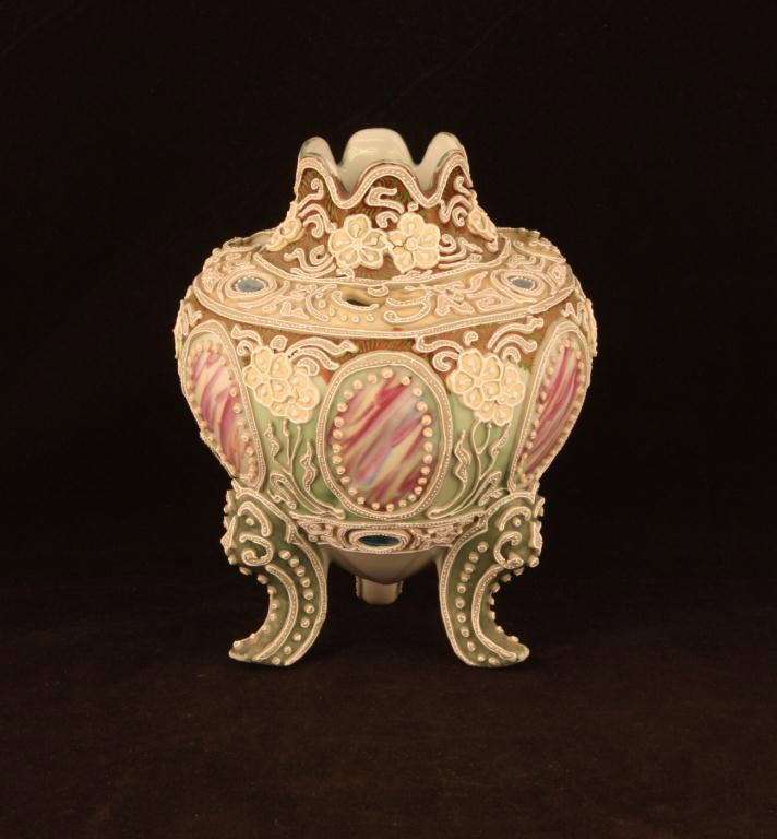 NIPPON Moriage Three-Footed Vase: 6.75" tall. Nice form with three cut-outs on top. Six red & white windows and 6 teal windows at top & bottom. Unmarked. Good condition with a few beads missing and green matte finish missing on ends o