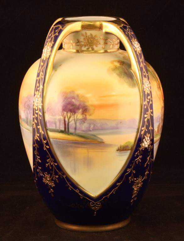NIPPON Bulbous Four-Handled Cobalt Vase: 8.75" tall. Lake & tree scene around piece with gold & enamel decoration. Mark 47. Excellent condition.