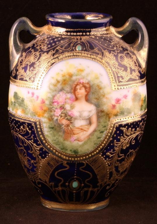 NIPPON Cobalt Portrait Vase of Woman with Flower: 6" tall. Gold scroll work with green jewel at top of portrait. Mark 52. Excellent condition with minor gold loss.