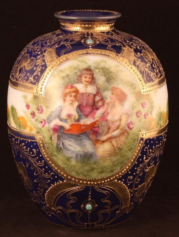 NIPPON Bulbous Cobalt Portrait Vase: 6 3/4" tall. Man with two women. Jeweled at top and bottom of portrait. Mark 52. Excellent condition with minor gold loss.