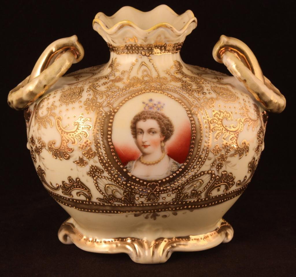 NIPPON Portrait Vase of Marie de Medici: 5 1/2" tall. Marie de Medici was the 2nd wife to Henry IV in the 1600's. Beautiful gold scroll work. Double loop handles. Mark 52. Excellent condition with heavy gold loss to top and handles. Plate 38