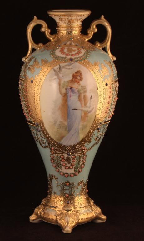NIPPON Beautiful Portrait Jeweled Urn: 12" tall. "Lady with Doves" pattern. This portrait vase is found on R.S. Prussia as well. Great gold scroll decor. Jeweled throughout. Mark 52. Excellent condition ith gold loss to rim, handles and fe