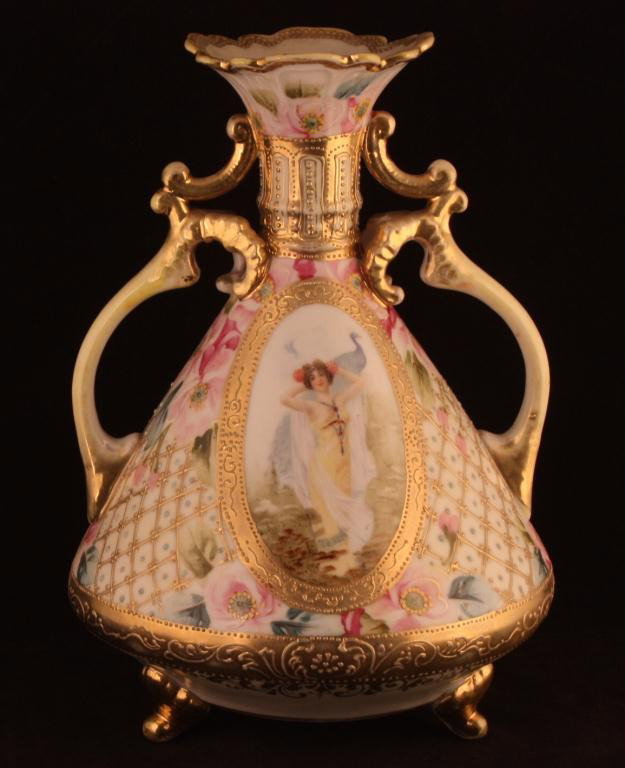 NIPPON Double Handled Three Footed Portrait Vase: 9 3/4" tall. "Lady with Peacock" pattern. Portrait is found on R.S. Prussia as well. Mark 52. Good condition with heavy gold loss to rim and handles.