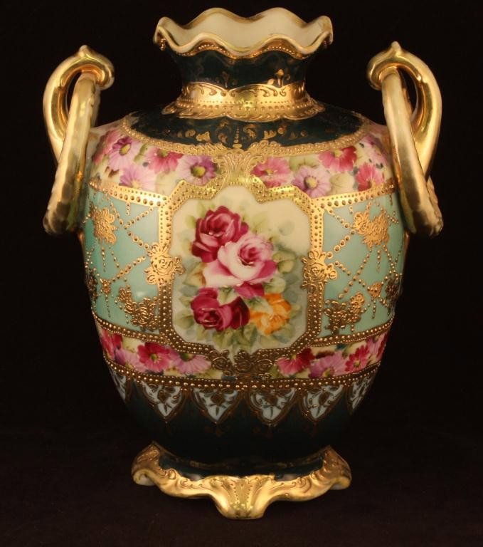 NIPPON Double Loop Vase: 8 1/2" tall. Red and Pink rose Floral Design with Gold scroll. Excellent condition with gold loss to handle and top rim. Mark 52.
