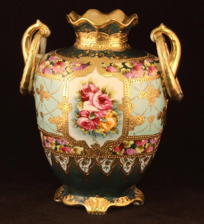 NIPPON Double Loop Vase: 8 1/2" tall. Red and Pink rose Floral Design with Gold scroll. Excellent condition with gold loss to handle and top rim. Mark 52.