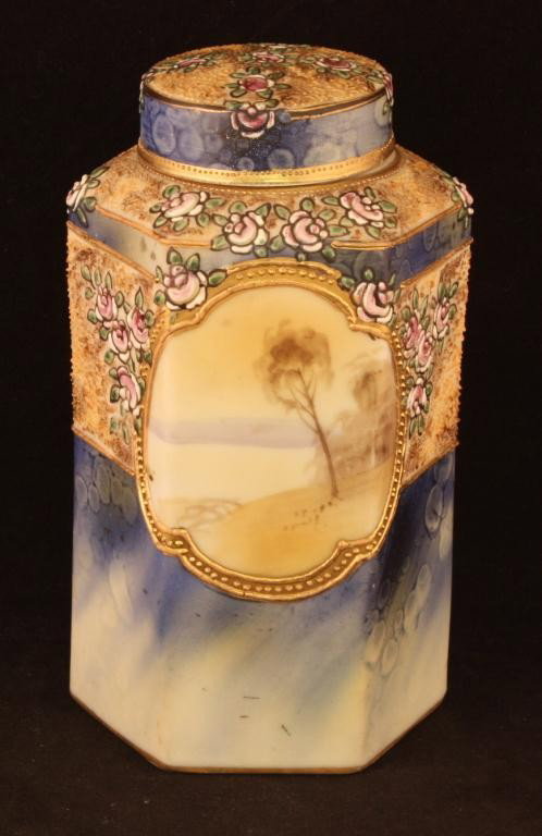 NIPPON 6 Sided Covered Jar: 6 1/2" Tall. Landscaped medallion on front and back. Pink Floral Enamel on blue background. Excellent condition. Mark 47.