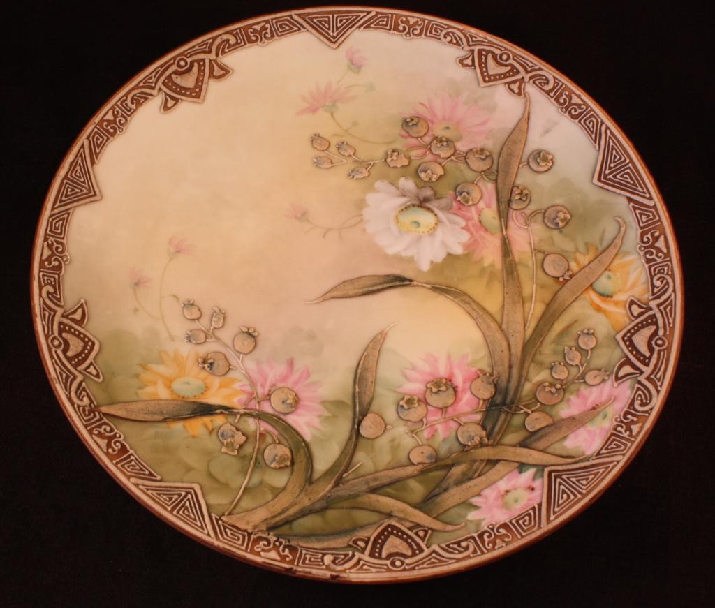 NIPPON Relief Floral Painted Wall Hanging Plate: 8 3/4" in diamter, minor chips on unblossomed flowers (seen in picture)