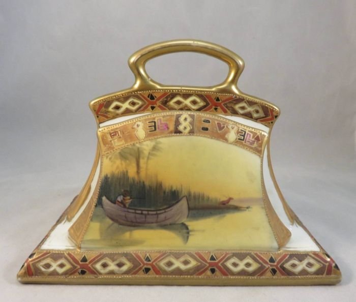 Rare American Indian "Coming to the Call" Letter Holder: "M in Wreath" #47 Description: You are viewing a seldom-seen Antique Nippon Letter Holder featuring the Frederic Remington painting "Coming to the Call". "Coming to the Call" was published as a full-c