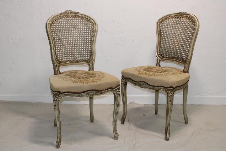 Pair of European cane back chairs: A vintage pair of European painted cane back chairs with seats showing a romantic scene. Bidding is for the pair, dimensions are per chair