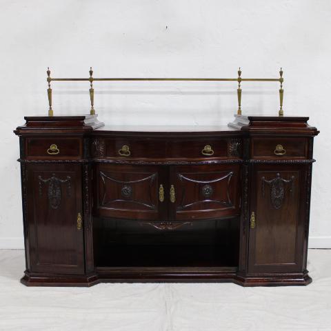 Antique Mahogany Buffet: British Antique carved Mahogany drop center twin pedestal Buffett with Brass Gallery with felt lined silverware drawer circa 1880