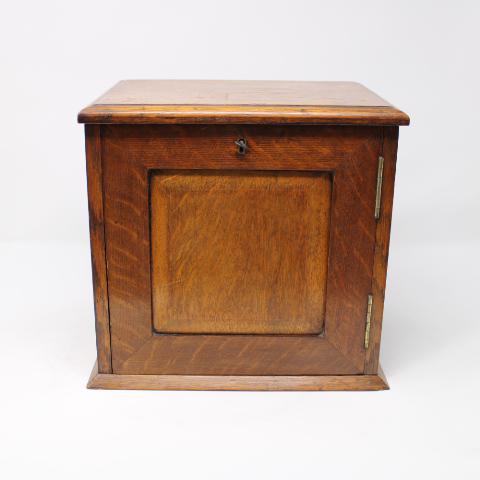 British Smokers Box in Oak: A lift Top Antique smokers box from England, includes the wooden canister. Key Included.