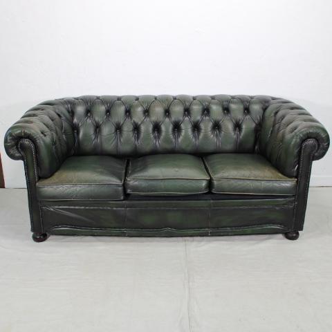 Green Chesterfield Sofa: English green chesterfield 3 seat leather sofa on bun feet. Green leather to the front & Cushions.