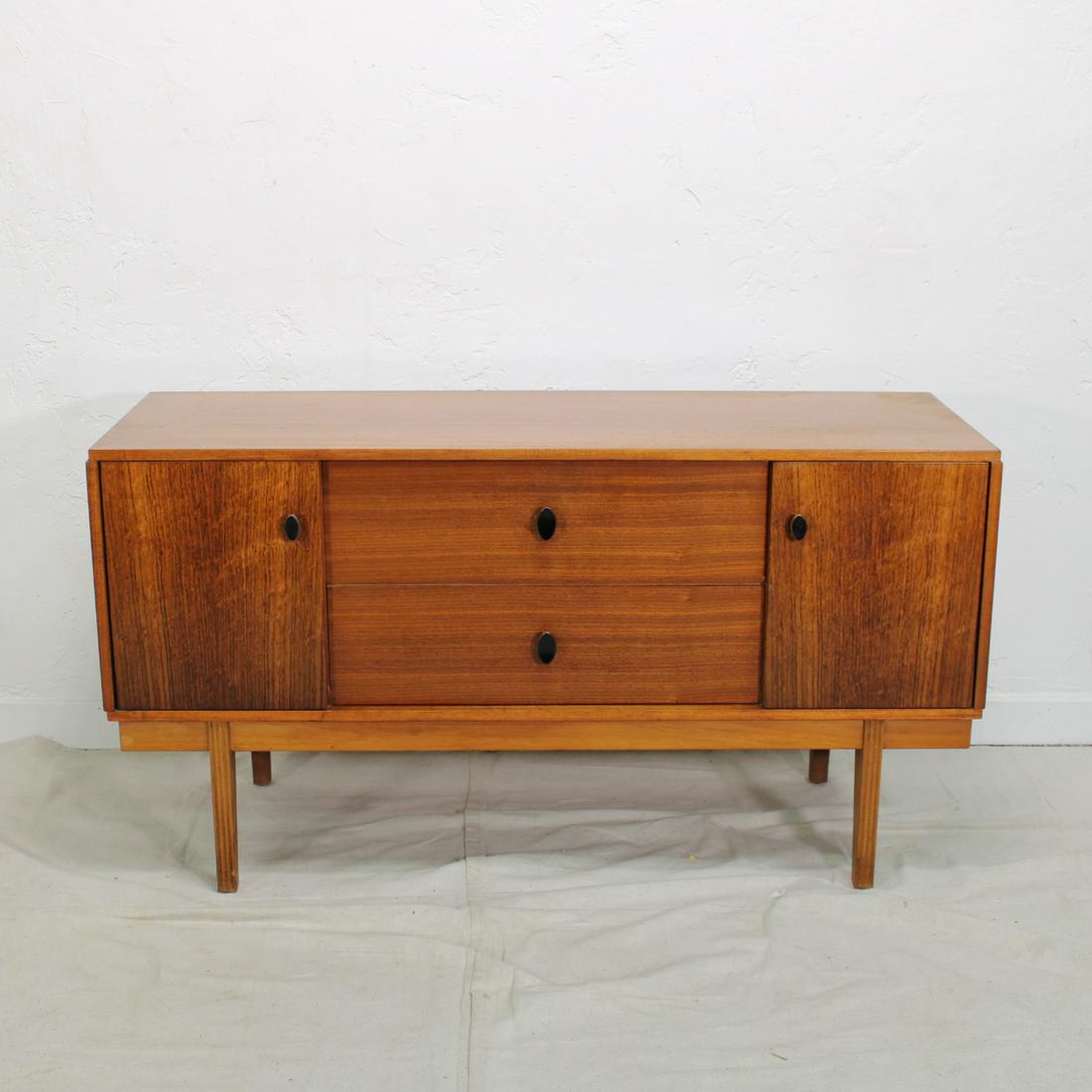 Mid Century Modern Sideboard: This Danish Modern style credenza is from England. It features metal handles, two drawers in the center flanked by two doors.