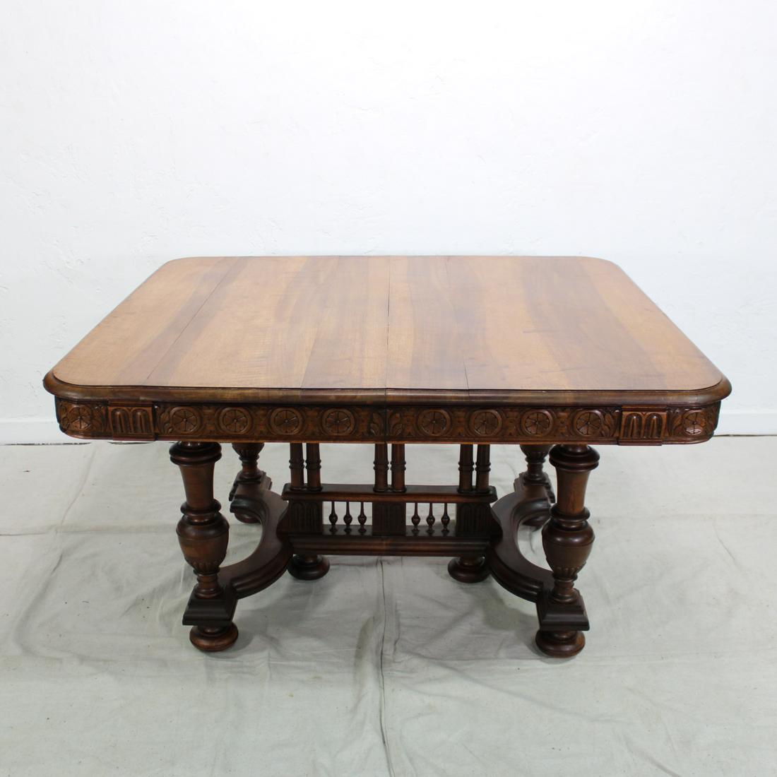 Henri II Style Dining Table: This French Henry II Style Table in Walnut features a carved apron and beautiful turned legs. It matches lot 38 & 40. Sent to us directly from France.