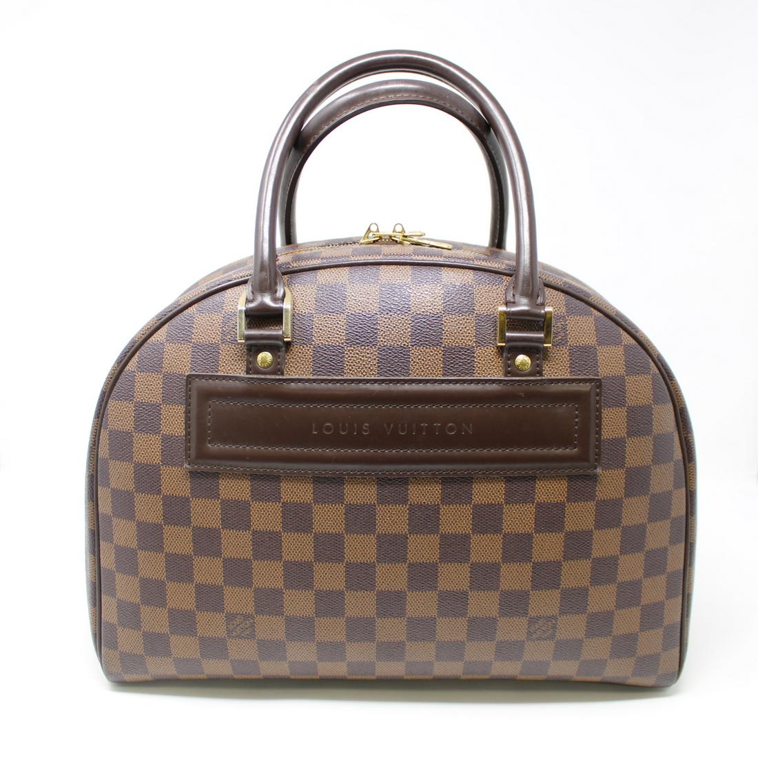 Louis Vuitton Nolita: Genuine Pre-Owned Louis Vuitton Nolita in Brown Damier Ebene in A condition. Date Code is SP0021. Measurements: 35*24*15cm (Length * Height * Width). This lot includes a certificate of authenticity.