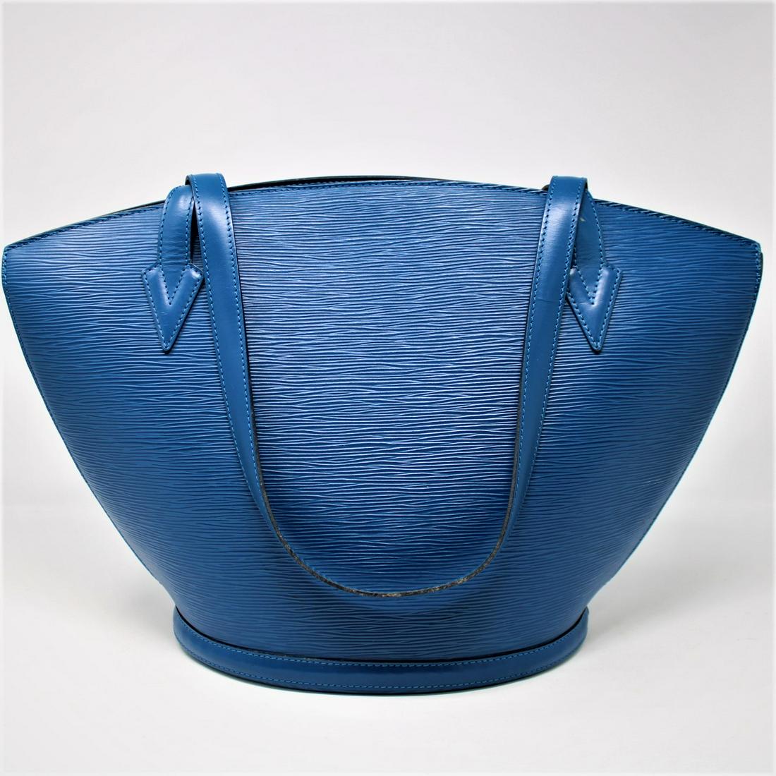 Louis Vuitton St-Jacques Shopping GM: Genuine Pre-Owned Louis Vuitton St-Jacques Shopping GM in Blue Epi in AB condition. Date Code is AS0956. Measurements: 26*30*17cm (Length * Height * Width). This lot includes a certificate of authenti