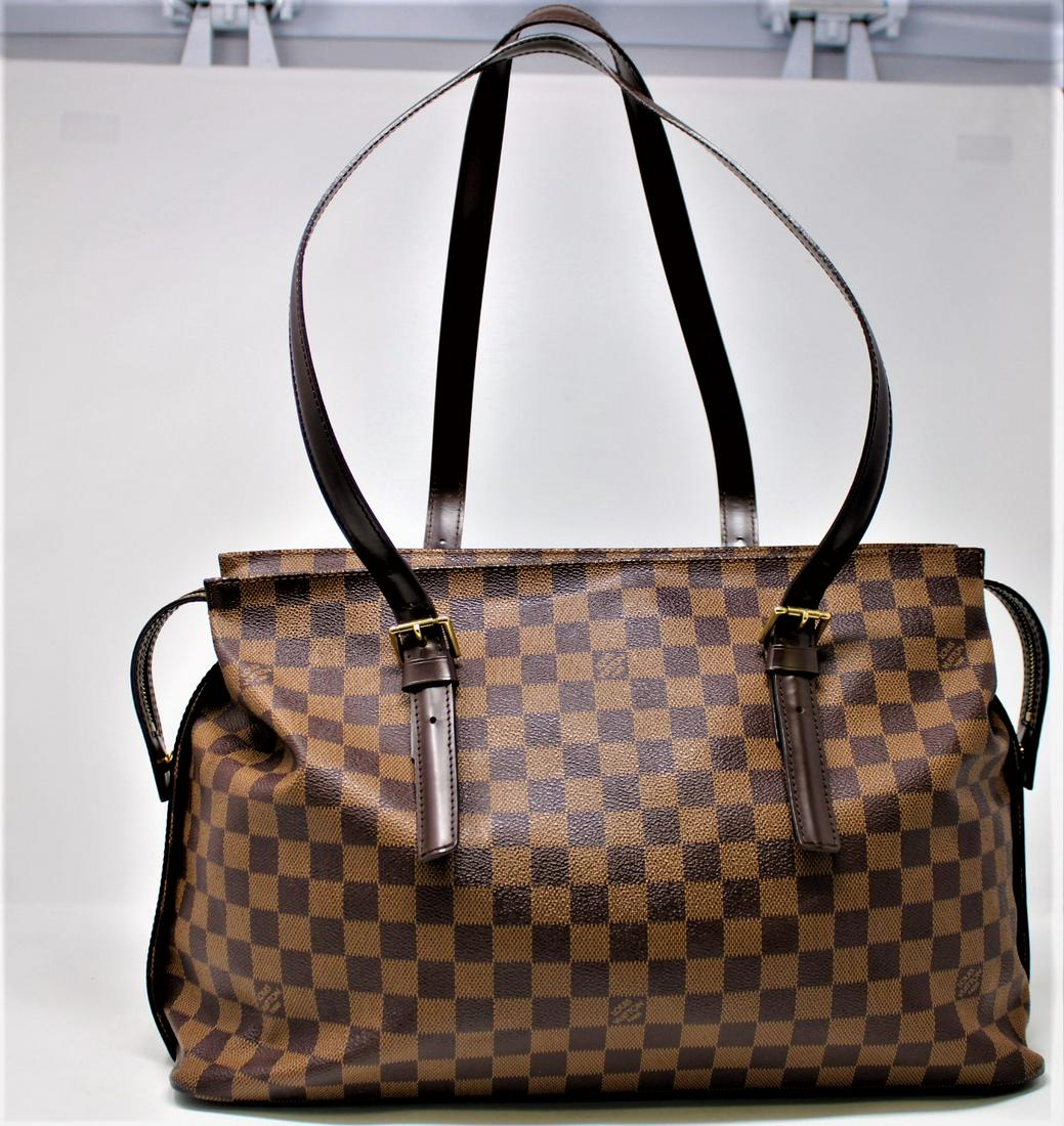 Louis Vuitton Chelsea: Genuine Pre-Owned Louis Vuitton Chelsea in Brown Damier Ebene in A condition. Date Code is TH1023. Measurements: 41*27*15cm (Length * Height * Width). This lot includes a certificate of authenticity.