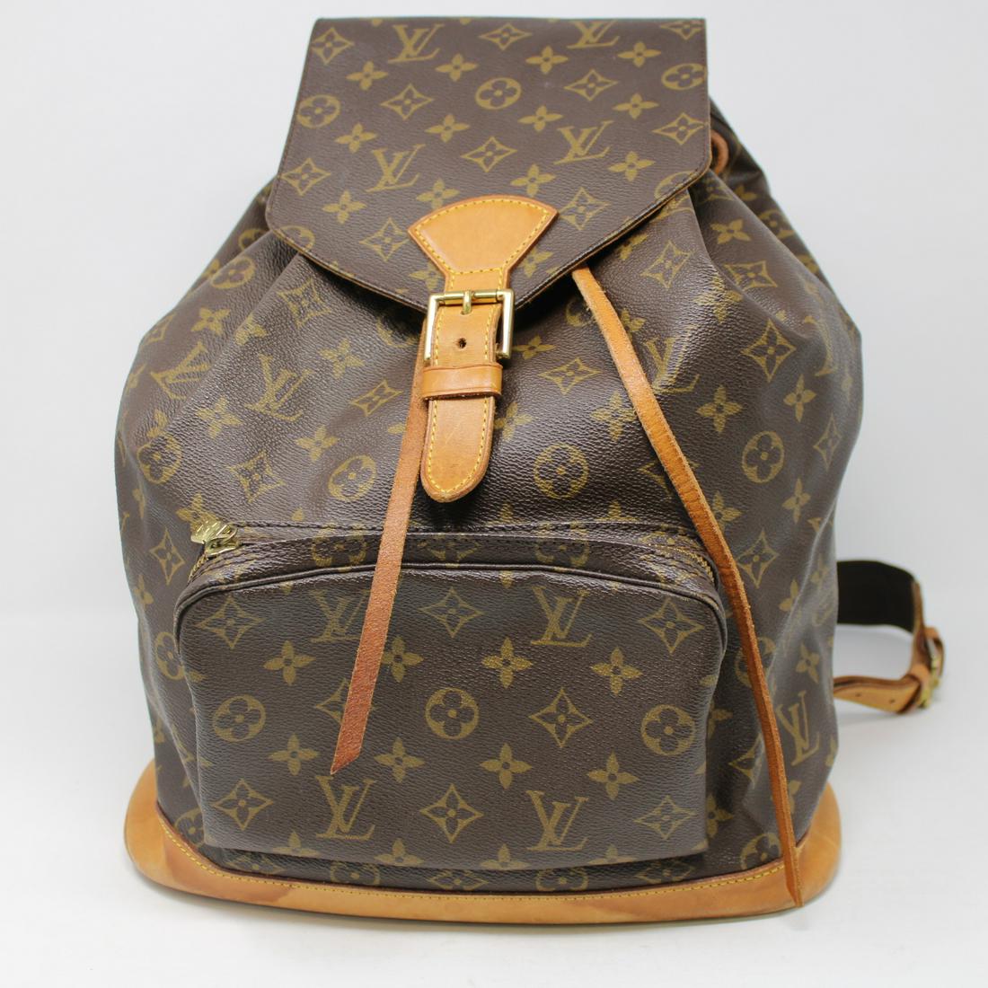 Louis Vuitton Montsouris GM: Genuine Pre-Owned Louis Vuitton Montsouris GM in Brown Monogram Canvas in AB condition. Date Code is MI0995. Includes Dustbag. Measurements: 30*35*12cm (Length * Height * Width). This lot includes a c