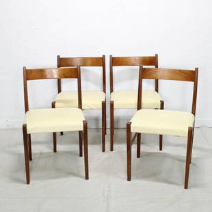 Set of 4 Mid Century Modern Chairs: Set of 4 Teak Dining Chairs with white vinyl upholstery. Likely Danish Modern. 30 tall x 18 x 18