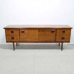 British Mid Century Modern Sideboard - Sliding Doors: This Teak Danish modern style credenza is from England made by Bath Cabinet Makers. It is often in correctly described as being made by Danish maker Mogens Kold. 30 tall x79 wide x 19 deep