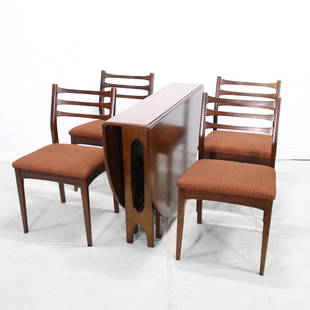 Mid Century Modern Drop Leaf Dining Table & 4 Chairs: This Danish modern style drop leaf table and 4 dining chairs are from England. Table is 30 tall x 10in closed / 62 in open x 43 wide . Chairs are 33 tall x 19 x 18