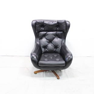 European Black Vinyl Swivel Chair #1: Mid Century Modern Black Lounge Chair or Egg Chair in Vinyl. Danish Modern Style, from Europe, chair swivels well on a four leg base. This chair is very similar to lot 25 but not an exact match.