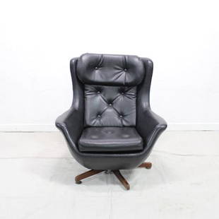 European Black Vinyl Swivel Chair #2: Mid Century Modern Black Lounge Chair or Egg Chair in Vinyl. Danish Modern Style, from Europe, chair swivels well on a five leg base. This chair is very similar to lot 24 but not an exact match.