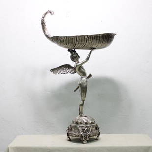 Silver Winged Bowl with coin silver overlay: This bronze bowl is supported by a winged angel figure on a beautiful fitted base and has a coin silver coating over the bronze. Would work well as a wine chiller.