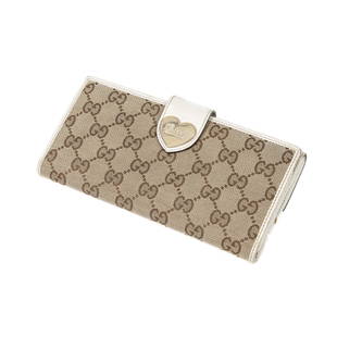 Gucci Large Heart Lock Wallet: Preowned designer wallet - Gucci Brand - in Beige Monogrammed Canvas - includes Certificate of Authenticity from BrandCo Paris.