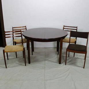 Rosewood Round Dining Table & 4 Chairs: This Danish Modern dining set includes the round dining table and 2 20 inch leaves by Skovby mobelfabrik, 1 chair by Uldum Mobelfabrik / likely Johannes Andersen & 3 chairs likely by Niels