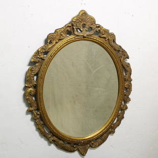 Louis XVI Style Gold Mirror: Louis XIV style oval gold framed mirror