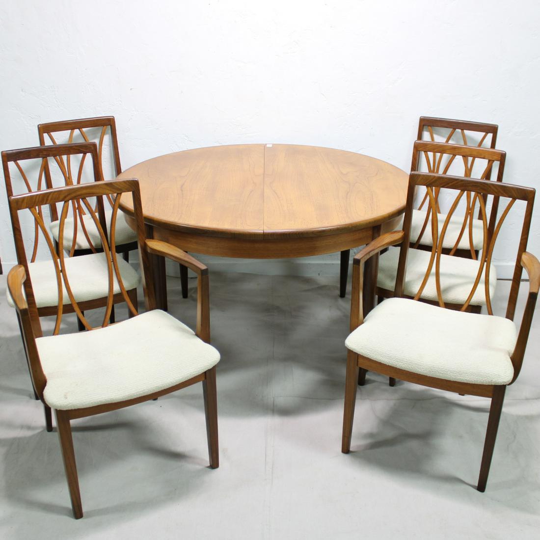 Mid Century Round Table & 6 Teak Chairs by G-Plan: This set of 6 Danish Modern Style dining chairs & round dining table are British and made by Mid Century Modern Furniture Maker G Plan ( Gplan ) - table is 29 in Tall x 49 in long with an 18 in pop ou