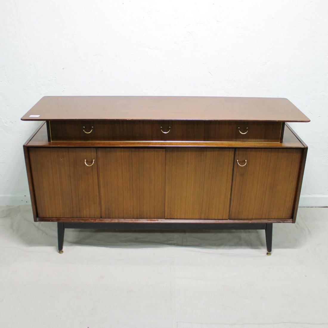 G-Plan Sideboard in Tola Wood with Ebonized Legs: This Danish Modern Style credenza is British and made by Mid Century Modern Furniture Maker G Plan ( Gplan ) - 34 in Tall x 59 wide x 19 deep