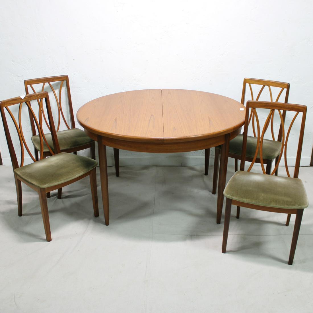 Mid Century Round Table & 4 Teak Chairs by G-Plan: This set of 6 Danish Modern Style dining chairs & round dining table are British and made by Mid Century Modern Furniture Maker G Plan ( Gplan ) - table is 29 in Tall x 49 in long with an 18 in pop ou