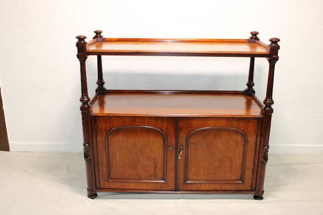 Victorian Dumb Waiter: British Mahogany Server circa 1870 direct from Wales, solid top with some wear, two doors with brass hardwear, carved roses in the front columns. Key is included.