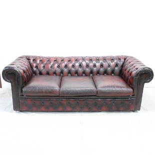 Oxblood red leather chesterfield sofa: British "oxblood" red leather chesterfield three seat sofa. Red leather to the front & on the cushions.