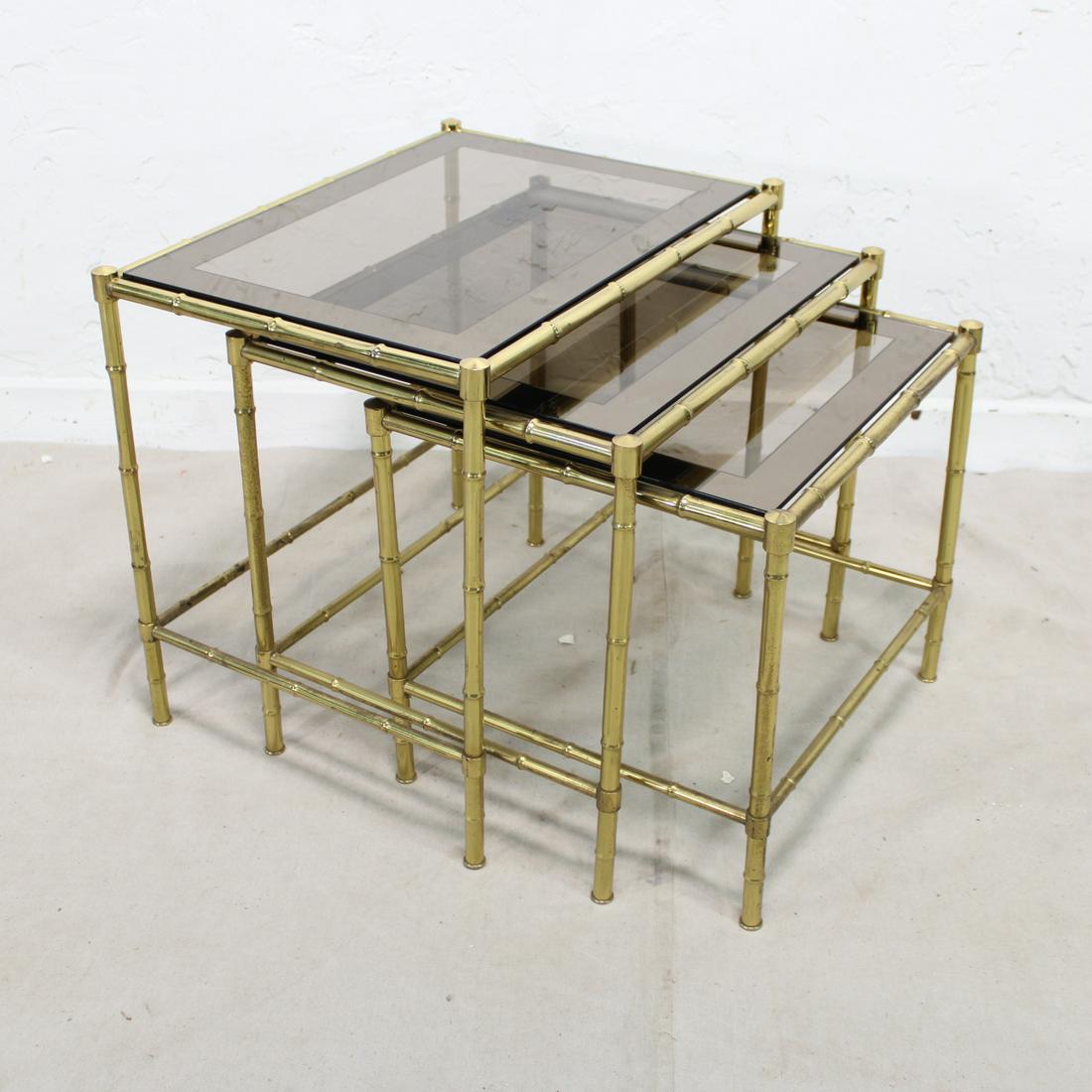Brass Faux Bamboo Nest of Three Tables From Europe: Mid Century Modern Brass Faux Bamboo Nest of Three Tables From Europe with Smokey Glass with Banding largest table is 19 tall x 21 x 16