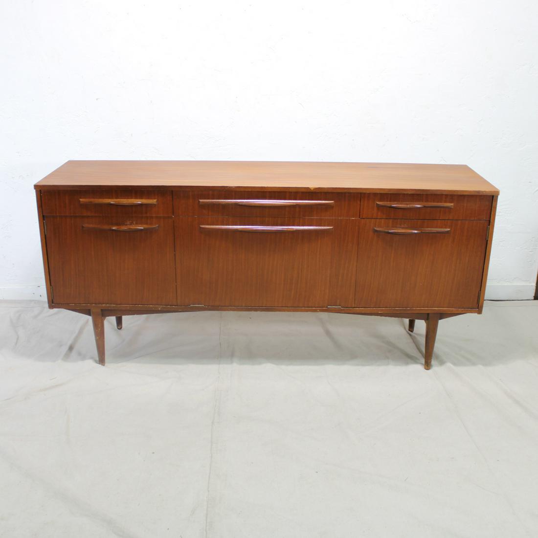 Mid Century Sideboard with Drop Front Cocktail Section: This Danish Modern Style Teak Credenza is British. 30 in tall x 67 in long x 19