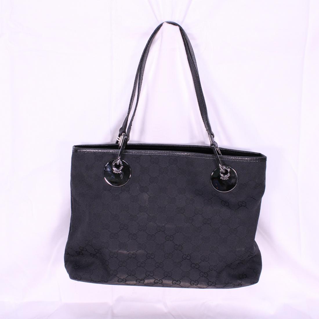 Gucci Eclipse Horizontal Tote in Monogrammed Canvas: Genuine Pre-Owned Gucci Eclipse Horizontal Tote in Navy Blue Monogrammed Canvas in AA condition. Date Code is 120837-001998. Measurements: 32*22*9cm (Length * Height * Width). This lot includes a cert