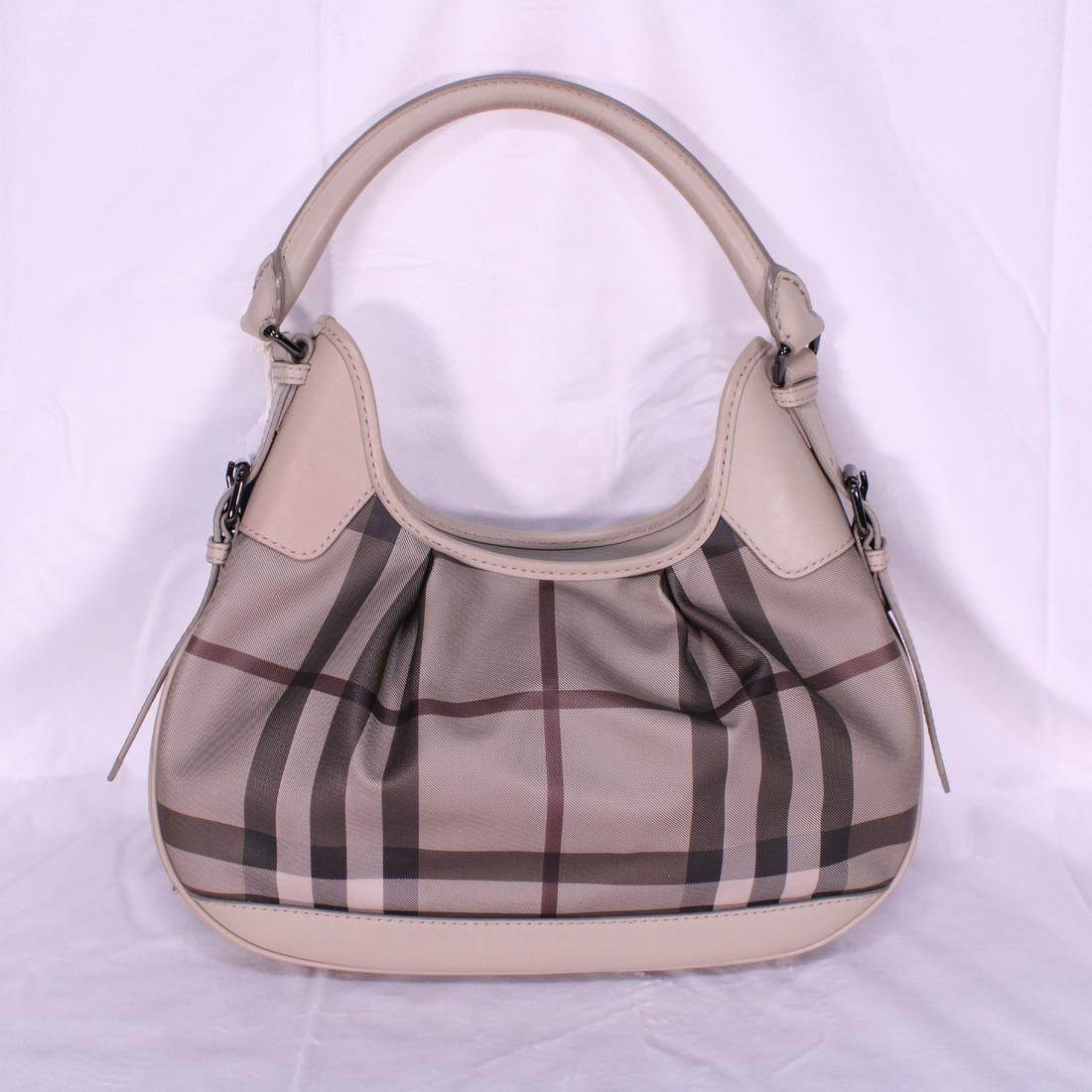 Burberry Brooklyn Hobo in Smoked Checked Canvas: Genuine Pre-Owned Burberry Brooklyn Hobo in Grey Smoked Checked Canvas in A condition. Date Code is CNDONHOUDON. Includes Dustbag. Measurements: 35*20*5cm (Length * Height * Width). This lot includes