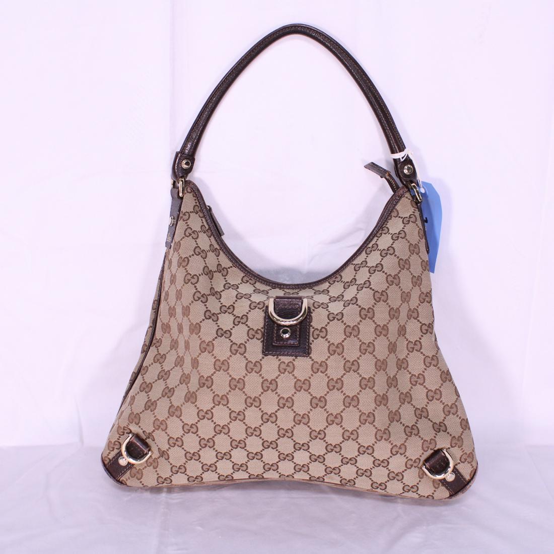 Gucci Abbey Hobo 3 D-Ring in Monogrammed Canvas: Genuine Pre-Owned Gucci Abbey Hobo 3 D-Ring in Beige/Dark Brown Monogrammed Canvas in AB condition. Date Code is 130737/493492Dustbag. This lot includes a certificate of authenticity.