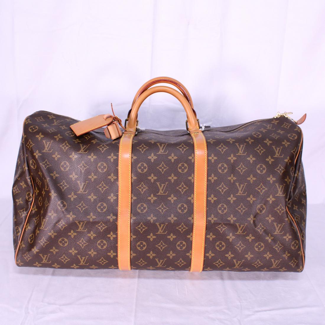 Louis Vuitton Keepall 60 in Monogram Canvas: Genuine Pre-Owned Louis Vuitton Keepall 60 in Brown Monogram Canvas in A condition. Date Code is MI881. Includes Luggage Tag, Handle Strap. Measurements: 60*26*31cm (Length * Height * Width). This lot