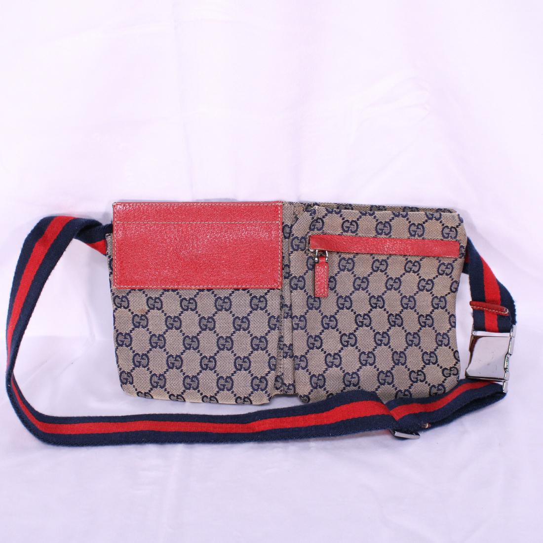 Gucci Waist Pouch in Monogrammed Canvas: Genuine Pre-Owned Gucci Waist Pouch in Beige/Red/Navy Blue Monogrammed Canvas in A condition. Date Code is 28566/200047. Measurements: 19*15*2cm (Length * Height * Width). This lot includes a certific